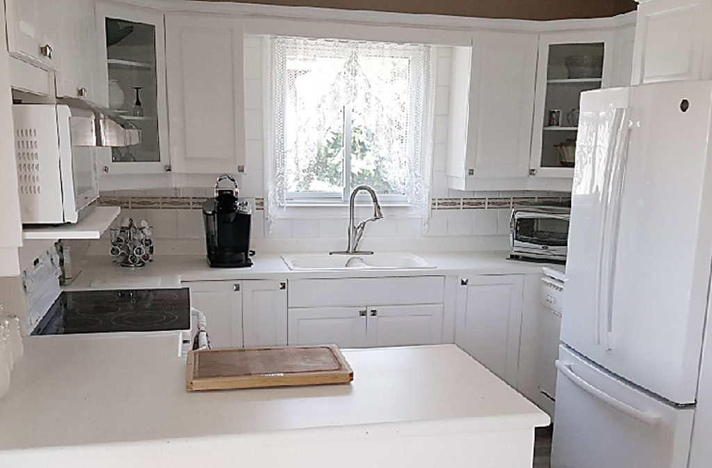 Beautiful white kitchen cabinets resurfaced by Epic Resurfacing Solutions