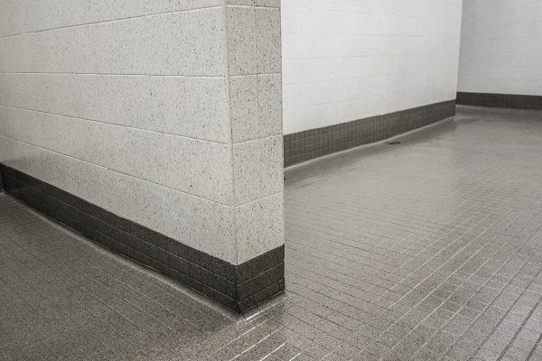 Commercial bathroom floor and wall resurfaced by Epic Resurfacing Solutions